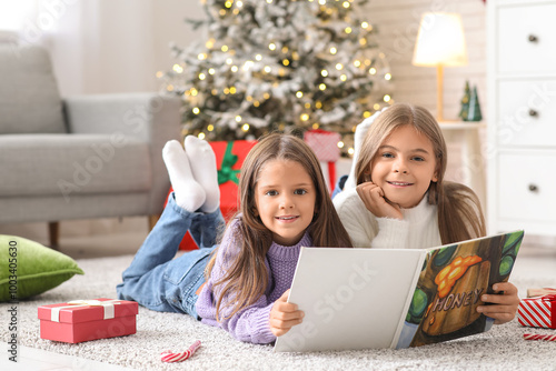 Happy young girls reading b...
