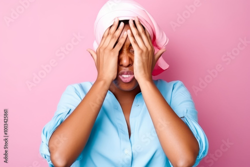 Young Woman Covering Face with Hands in Pink Headscarf  Pink Background