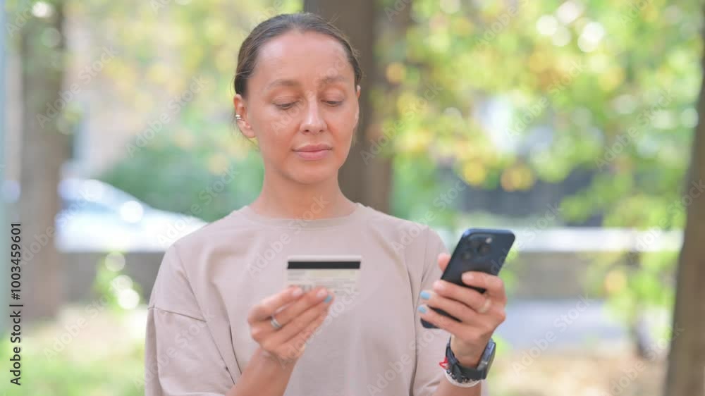 Portrait of Young Hispanic Woman Shopping Online with Phone Outdoor Portrait of Young Hispanic Woman Shopping Online with Phone Outdoor