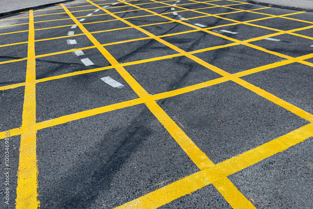prohibition of stopping a cars. yellow grid line on city crossroad. prohibition of stopping a cars. yellow grid line on city crossroad.