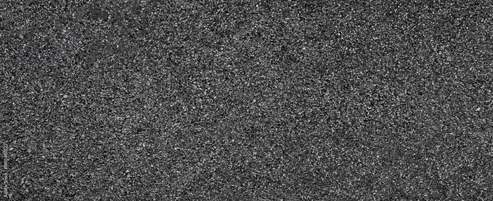 Detailed close-up of dark granular gravel texture, ideal for backgrounds, construction materials, or design elements. Detailed close-up of dark granular gravel texture, ideal for backgrounds, construction materials, or design elements.