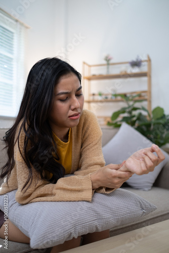 woman suffering pain on wrist hands and fingers, arthritis inflammation.