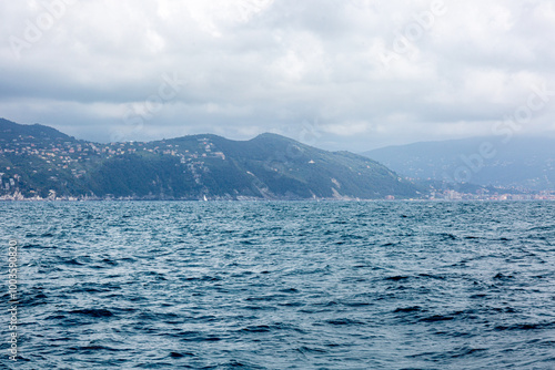 View to the shore near Portofino from the sea with dramatic sky