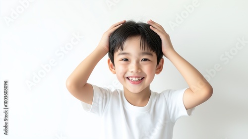 Asian boy with Hands on Head