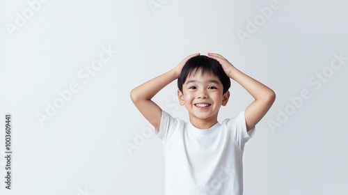 Asian boy with Hands on Head