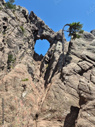 gigantic hole in the granite rock at Bocca di Velaco, Trou de la Bombe, at Conca, Sartène,  photo