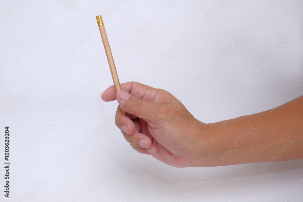 Someone pointing at something using pencil in the hand Someone pointing at something using pencil in the hand