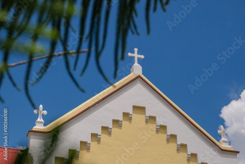 Close-up of St Anthony Church Facade with a White Cross in Teluk Intan, Perak, Malaysia on a Sunny Day photo