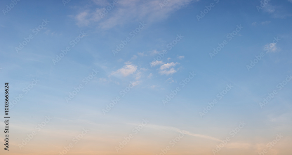 The clear blue sky with white clouds provides a bright and sunny background, enhancing the natural beauty of the landscape on this pleasant summer day The clear blue sky with white clouds provides a bright and sunny background, enhancing the natural beauty of the landscape on this pleasant summer day