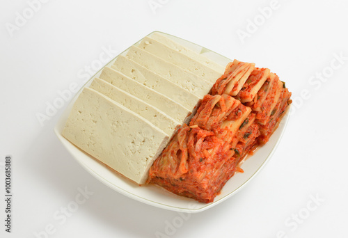 Korean food Mugeunji(ripened cabbage kimchi) and tofus on a dish with white background, South Korea photo