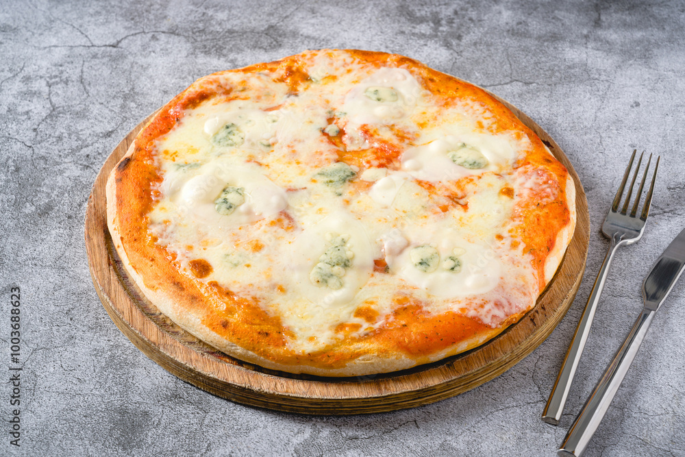 Four cheese neapolitan pizza on wooden cutting board on stone table Four cheese neapolitan pizza on wooden cutting board on stone table