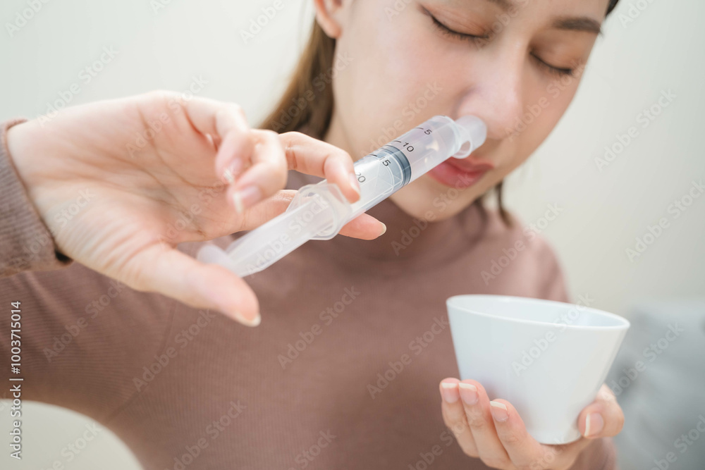 Close-up shot of woman cleaning her nasal. Close-up shot of woman cleaning her nasal.