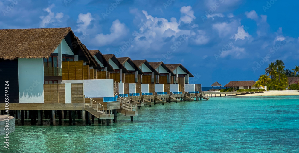 The Tropical aerial view with maldives paradise scenery seascape with water villas as amazing sea and lagoon beach, Exotic tourism The Tropical aerial view with maldives paradise scenery seascape with water villas as amazing sea and lagoon beach, Exotic tourism