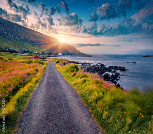 Windy morning scene of Hestur Island. Great sunrise on Kirkjubour village, Faroe Islands, Kingdom of Denmark, Europe.  Beautiful summer seascape of Atlantic Ocean. Travel the world..