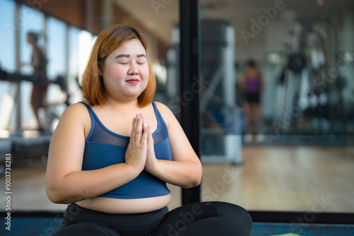 Overweight obese woman exercises on mat fitness Dieting and healthy lifestyle for burning fatFemale artist drawing with inspiration in art studio photo