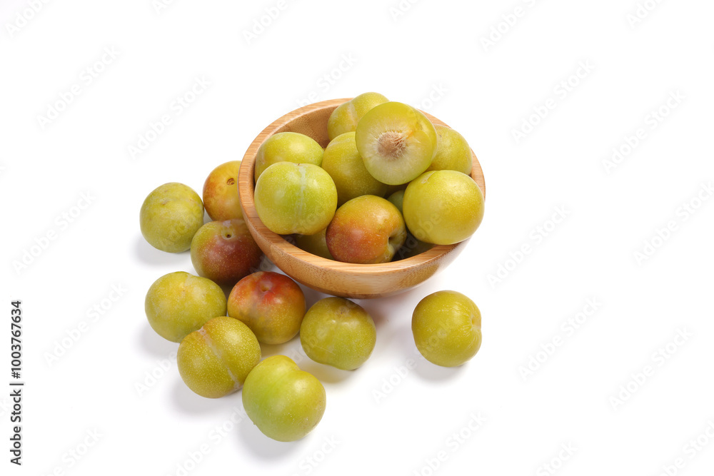 Ripe sweet small mini plum green maroon on white background Ripe sweet small mini plum green maroon on white background