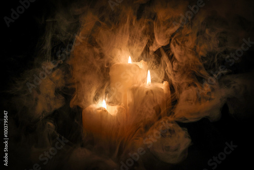 Lit candle flame through heavy smoke fog mist vapour flow twist beautiful mistic