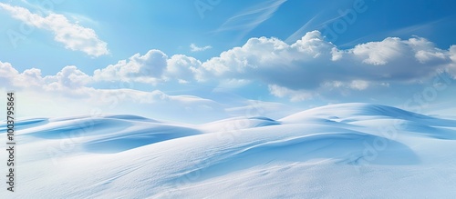 A serene winter landscape with pristine white snow and clear blue skies offers a beautiful copy space image