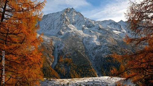 Landscape of the mountains, sky and forest in autumn. Snowcapped mountain. Gouille, Evolene, Switzerland. photo