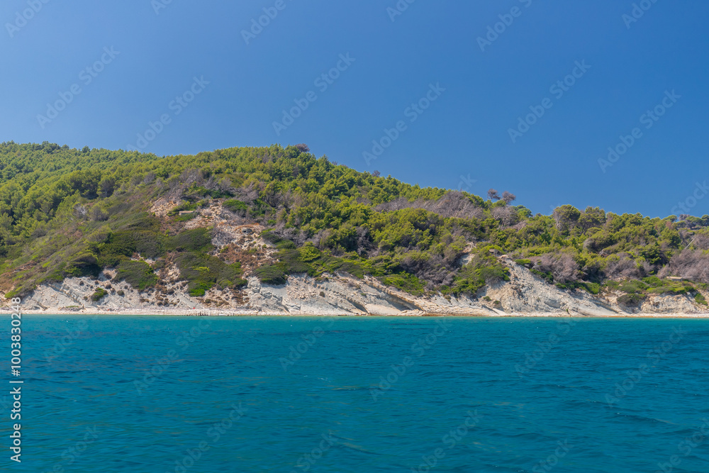 Sazan is an Albanian uninhabited island in the Mediterranean Sea. It us the largest of Albania's islands and it was a designated military exclusion zone. It lies in a strategically important location Sazan is an Albanian uninhabited island in the Mediterranean Sea. It us the largest of Albania's islands and it was a designated military exclusion zone. It lies in a strategically important location