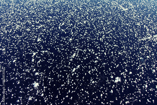 Glaciology. Young freshwater ice with characteristic tabular crystals of perspiration on the surface (crystal flake). Nilas at the age of 2 days, temperature. The most beautiful pattern