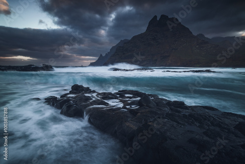 Obraz na płótnie Rocky coastline in Punta del Hidalgo in Tenerife- taken on long exposure time. Dramatic sky add a mood to this picture. w salonie