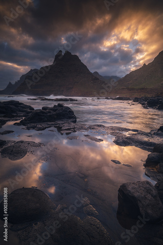 Obraz na płótnie Rocky coastline in Punta del Hidalgo in Tenerife- taken on long exposure time. Dramatic sky add a mood to this picture. w salonie