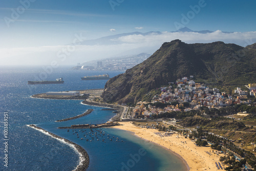 Obraz na płótnie Playa de Las Teresitas captured on a warm sunny day, with the Teide volcano visible in the background. w salonie