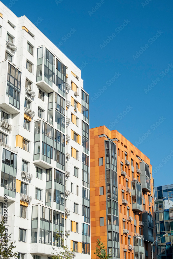 Modern European apartment blocks against a blue sky. Vertical frame Modern European apartment blocks against a blue sky. Vertical frame