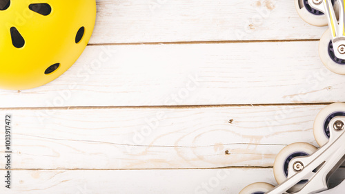 Protective equipment for active kinds of sports: rollers, bicycle, roller-skates on wodeen background photo