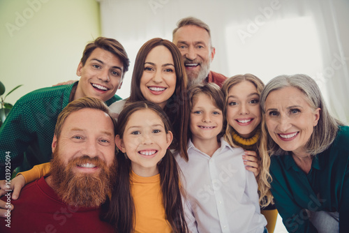 Photo of big family posing photo smile celebrate holiday dinner multi-generation relatives living room weekend