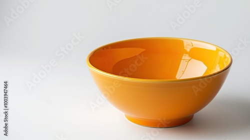 A large orange bowl sits on a white background