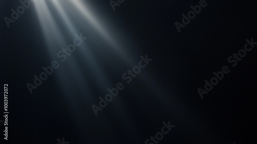 Graceful light beams shine through darkness on a black backdrop, adding elegance and mystery to your designs