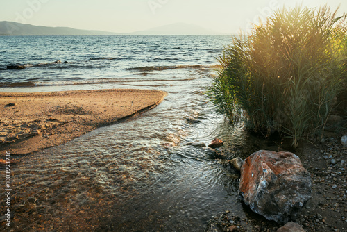 Richeios river mouth, one of the oldest rivers in Greece, flowing from lake Volvi through Macedonian Tempi valley to the Gulf of Strimonikos. photo