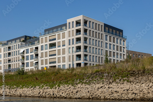 Kade Zuid exterior facades of newly build luxury apartment buildings along riverside of river IJssel seen from low water levels of the waterway. Engineering and urban development real estate concept.