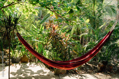 Inviting hammock in a lush tropical garden setting
