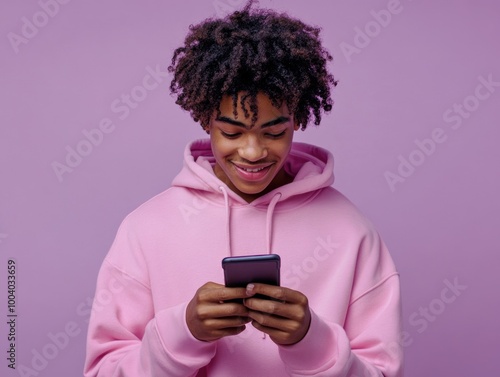 Young Man Engrossed in Phone