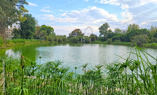 An autumnal view of a freshwater lake built for recrational purposes in Medterranean region photo