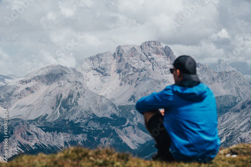 person on top of mountain looking at the landscape