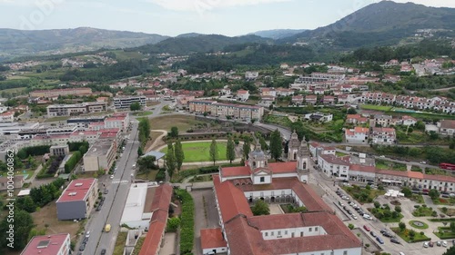 Aerial view of the Monastery of São Miguel de Refojos in Cabeceiras de Basto, Braga, Portugal, surrounded by urban and green landscapes photo