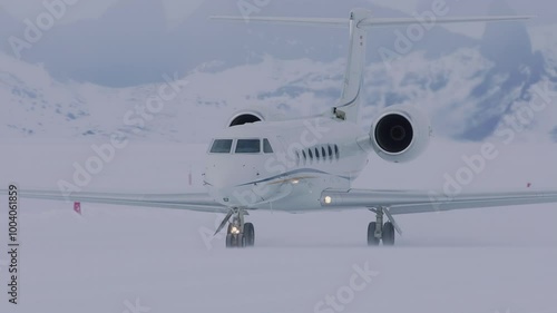 Airplane landing on snowy Antarctic runway amid breathtaking icy landscape