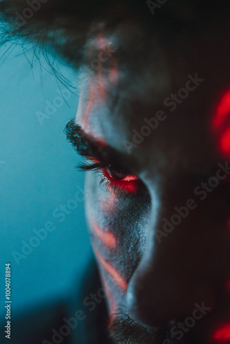 close up of a man's eye in a cyberpunk style with red lights
