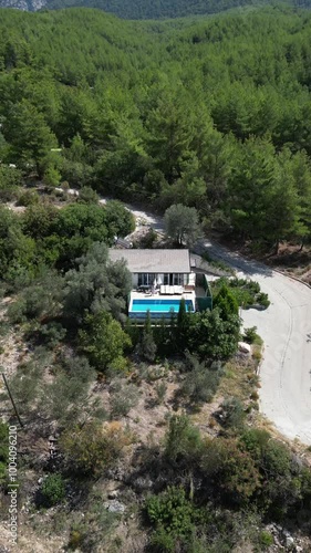 Aerial video above a villa in the Kelebekler Vadisi Beach area, Turkey photo