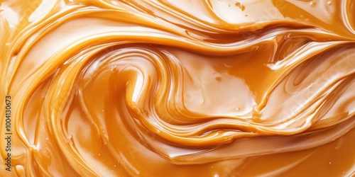 A close-up image of creamy caramel, showcasing its smooth and rich texture, perfect for food-related themes. photo