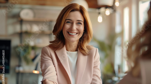 Cheerful Middle Aged Caucasian Businesswoman Smiling in a Bright Office Setting