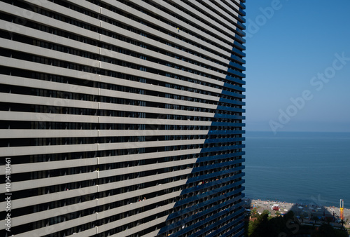 Orbi. Modern apartment buildings in Batumi. Tall buildings with solid windows. photo