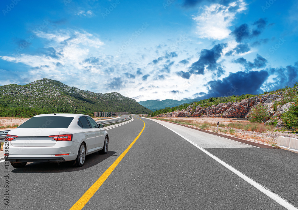 The car is driving along the highway surrounded by picturesque nature. The car is driving along the highway surrounded by picturesque nature.