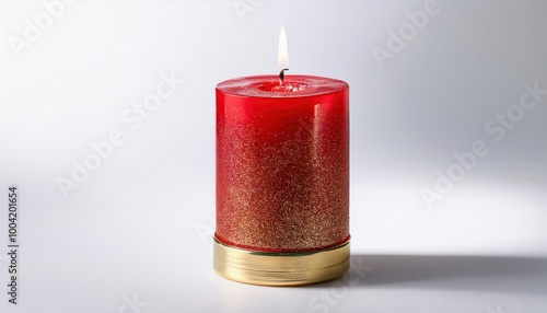 Elegant Red Pillar Candle with Gold Glitter Base, Lit and Set Against a Minimalist White Background. Perfect for Festive, Christmas Holiday, or Warm Home Decor Ambiances photo