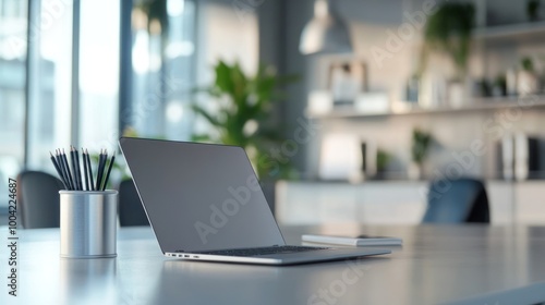 Wallpaper Mural A modern workspace featuring a laptop, stationery, and plants for a productive atmosphere. Torontodigital.ca