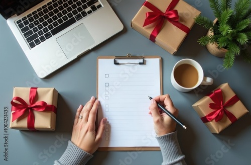 Woman making a gift shopping list at a desk with wrapped presents, a laptop, and coffee, planning the remaining holiday purchases